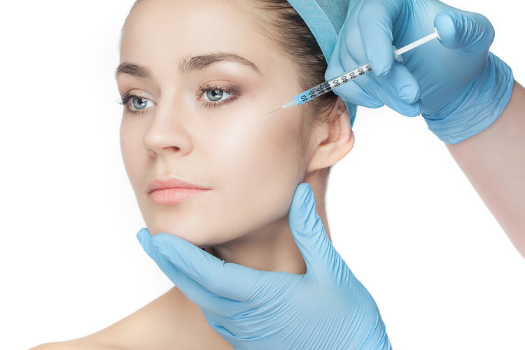 Young Woman Receiving a Dermal Filler in Her Cheek