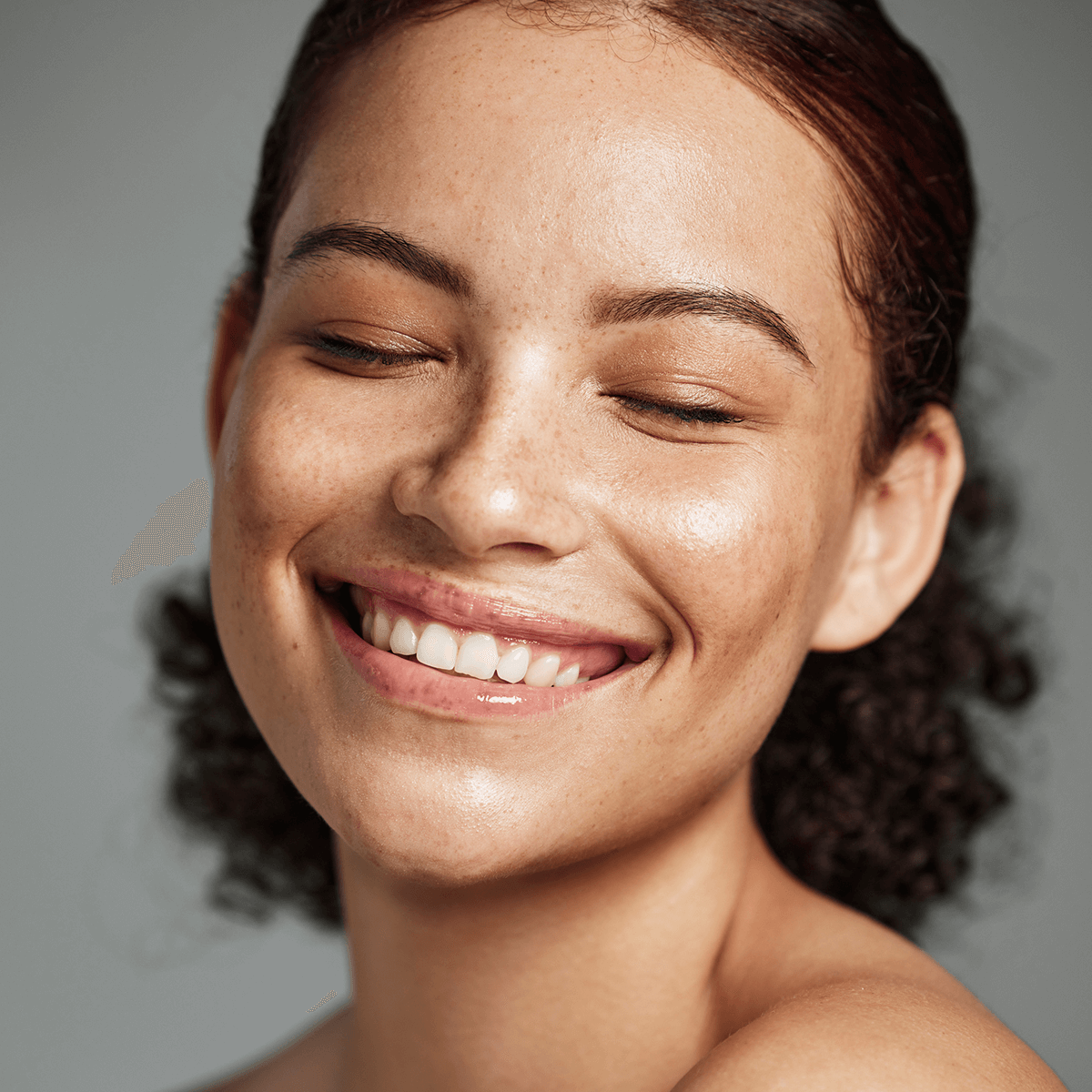 Woman with freckles smiling
