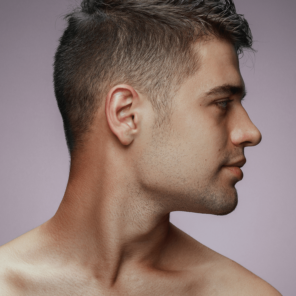 Man looking to the side with defined jawline