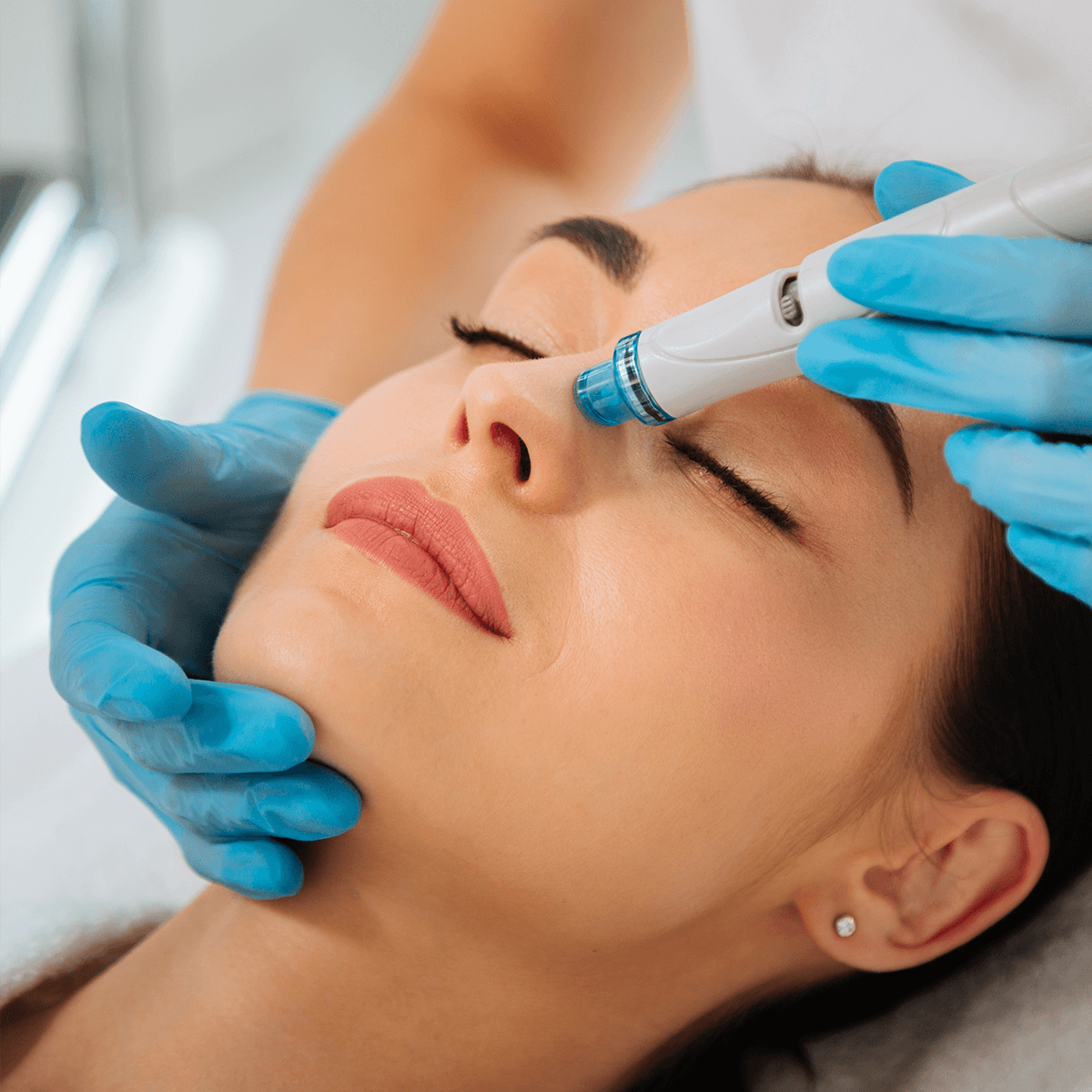 Woman getting a hydrafacial with custom boosters