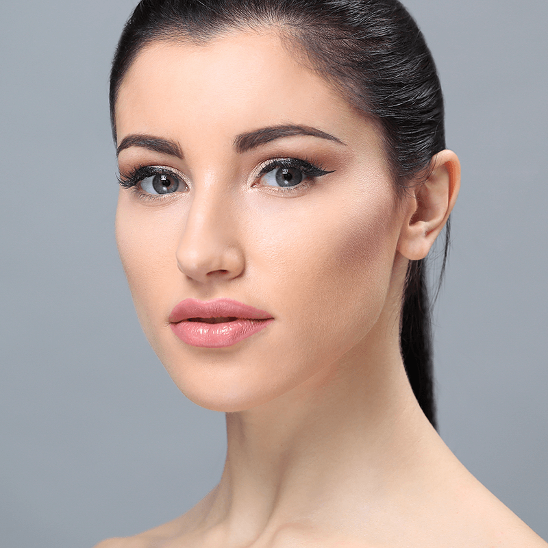 Woman looking up with smooth neck and defined jawline