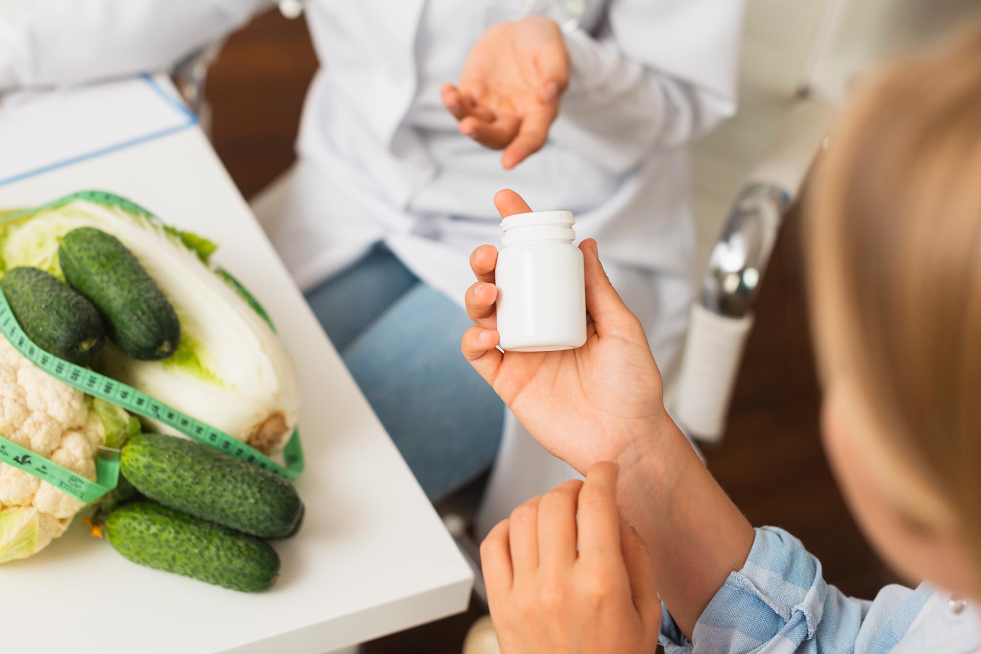 Couple taking weight loss supplement before dinner